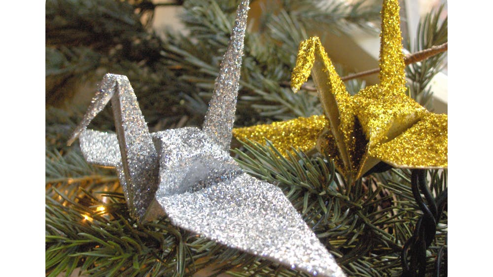La grue pailletée de Noël en origami