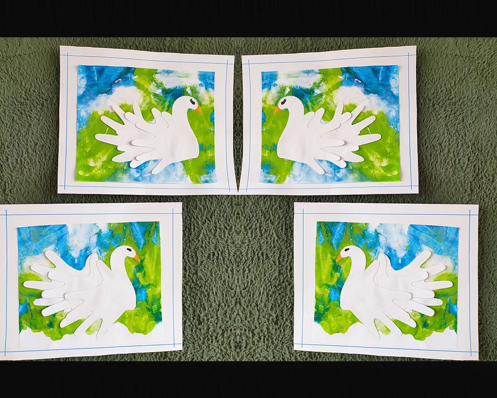Des cygnes fabriqués avec des mains en papier